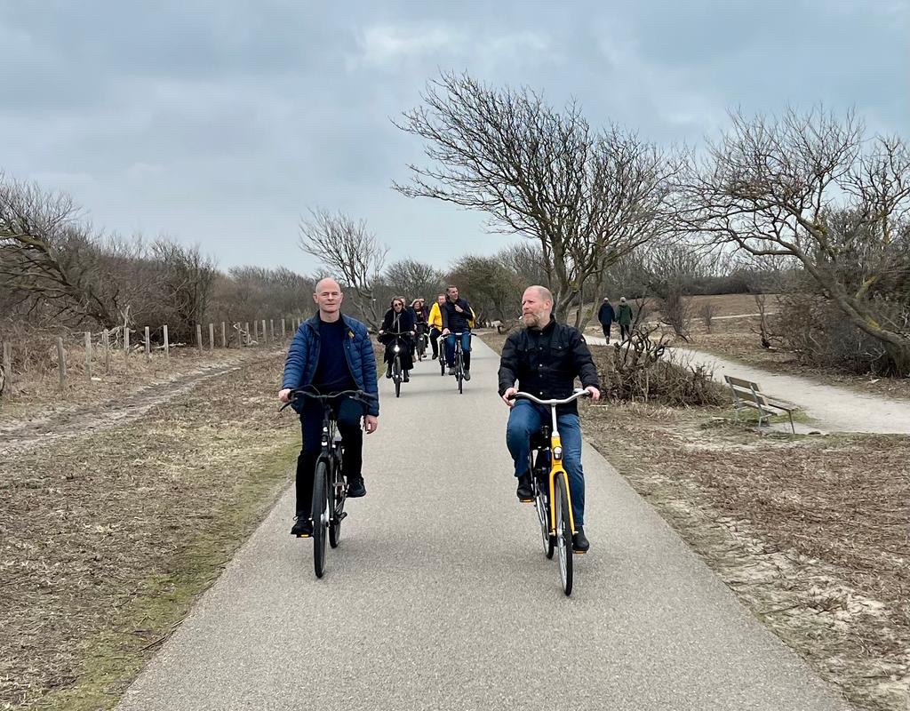 A group of visitors from Ireland cycling through the dunes in Westduinpark
